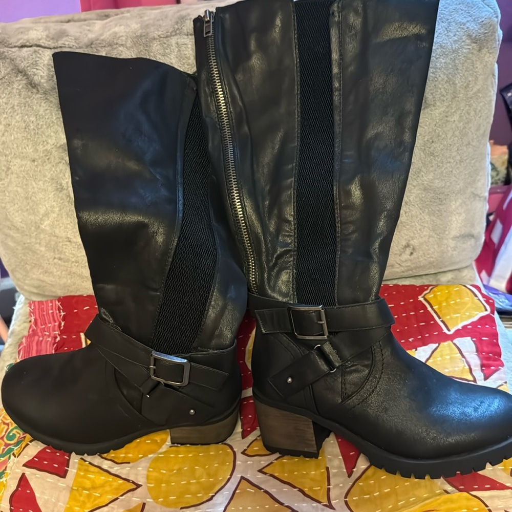 Black knee high boots.  Never worn.  Extra large calf (10”).